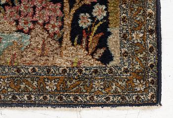 A semi-antique silk Ghom rug, central Iran, c. 32 x 23 in.
