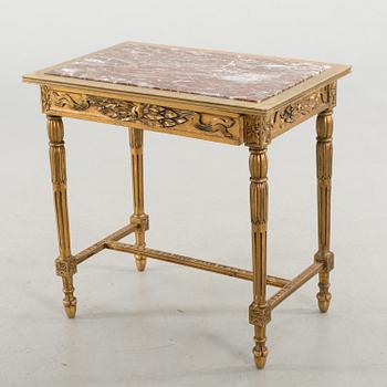 A Louis XVI-style table, first half of the 20th century.