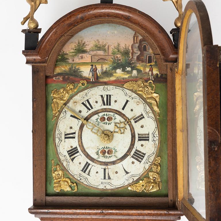 A Dutch wall clock, 18th/19th Century.