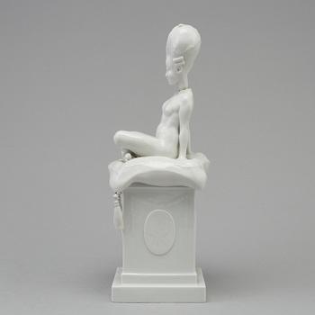 A white glazed Royal Copenhagen porcelain nodding head figure, Denmark, early 20th Century. Not first quality.