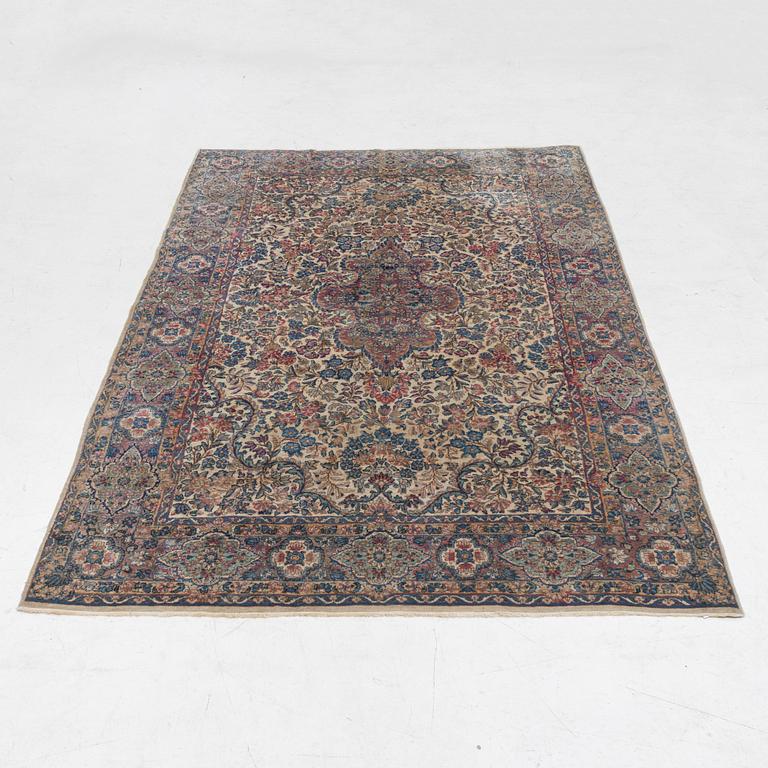 A semi-antique Kerman carpet, c. 273 x 172 cm.