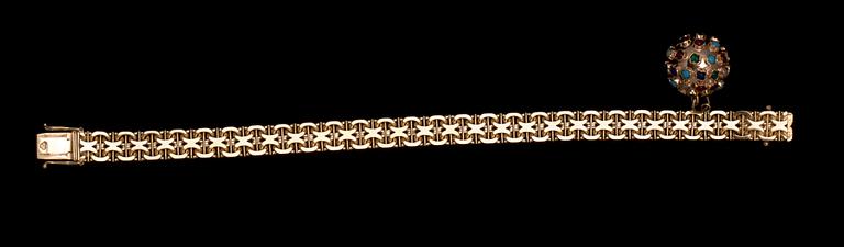 ARMLÄNK MED BERLOCK, 18 k guld samt cabochonslipade stenar. Segir, Köping, 1962. Vikt ca 25 g.