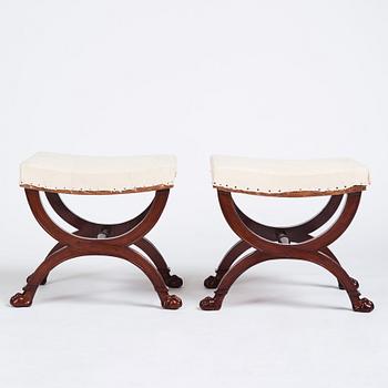 A pair of Directoire mahogany stools, circa 1800.