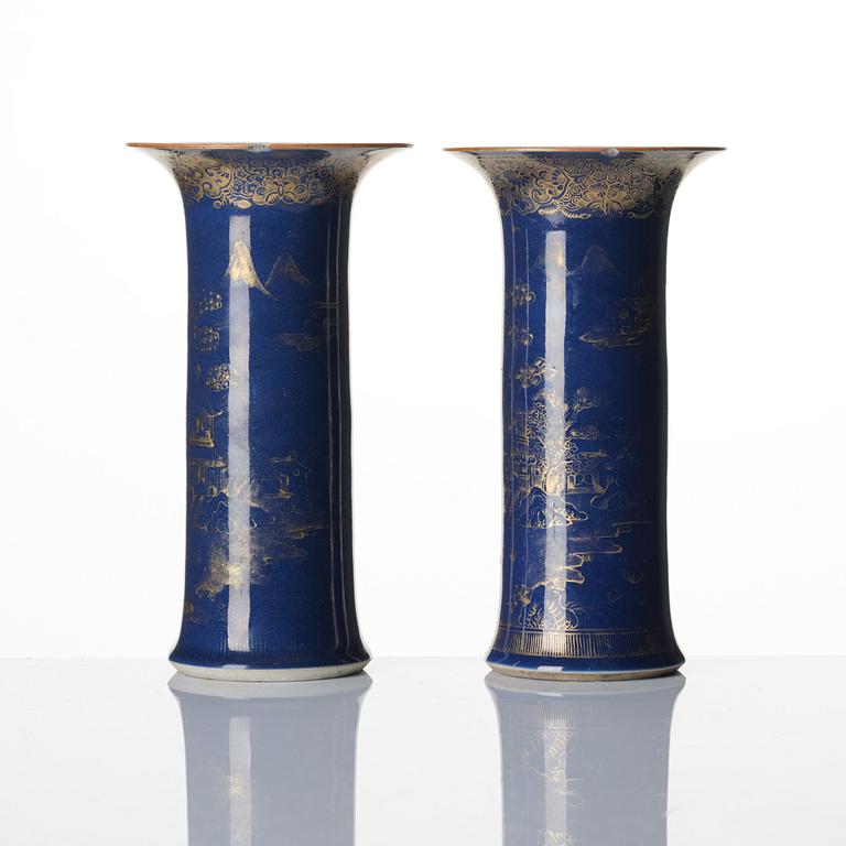 A pair of powder blue and gold 'trumpet' vases, Qing dynasty, 18th century.