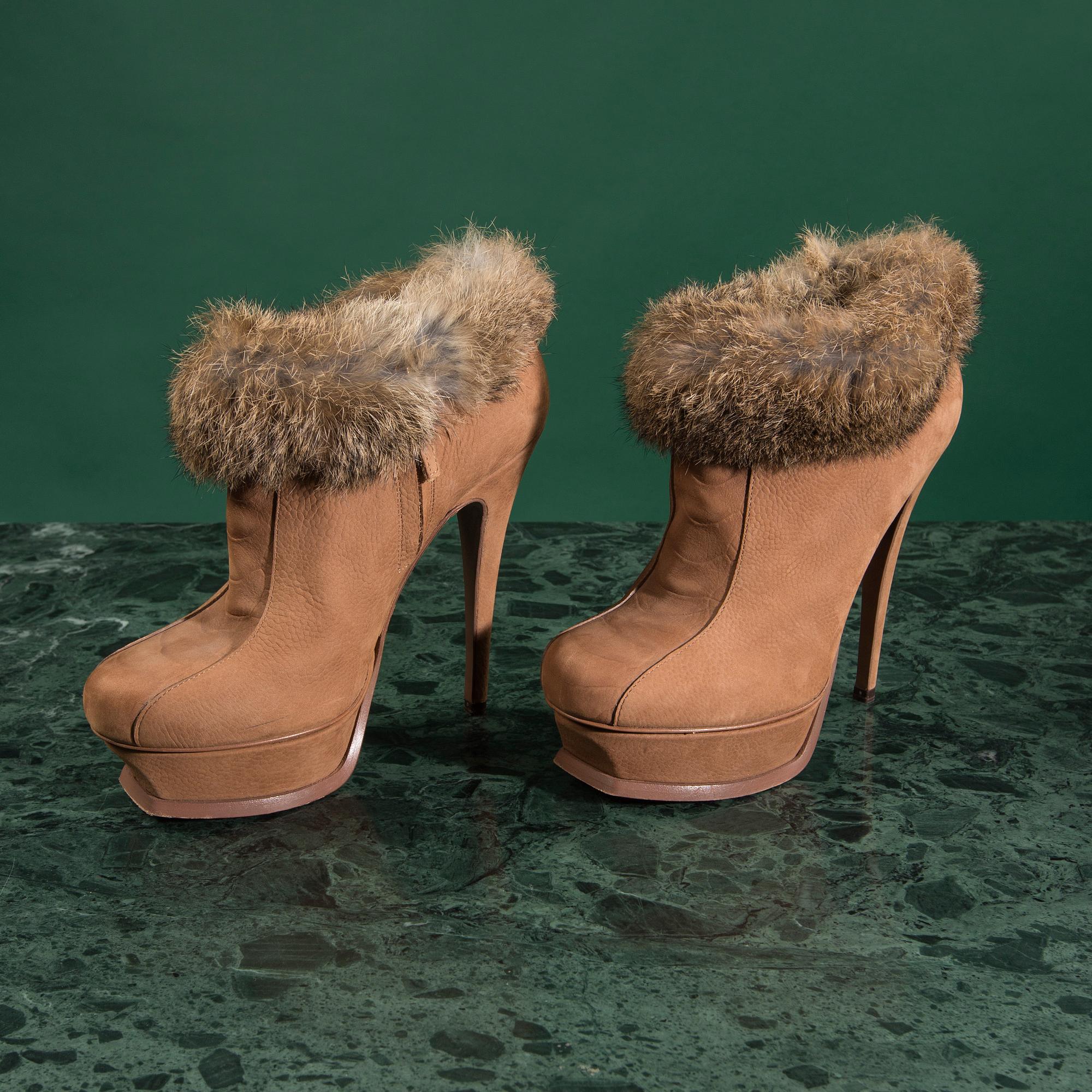 A pair of boots by YVES SAINT LAURENT,in size 37.