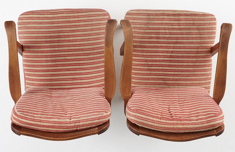 Nordiska Kompaniet, a pair of "sportstugemöbler" stained pine easy chairs, Sweden 1930-40's.