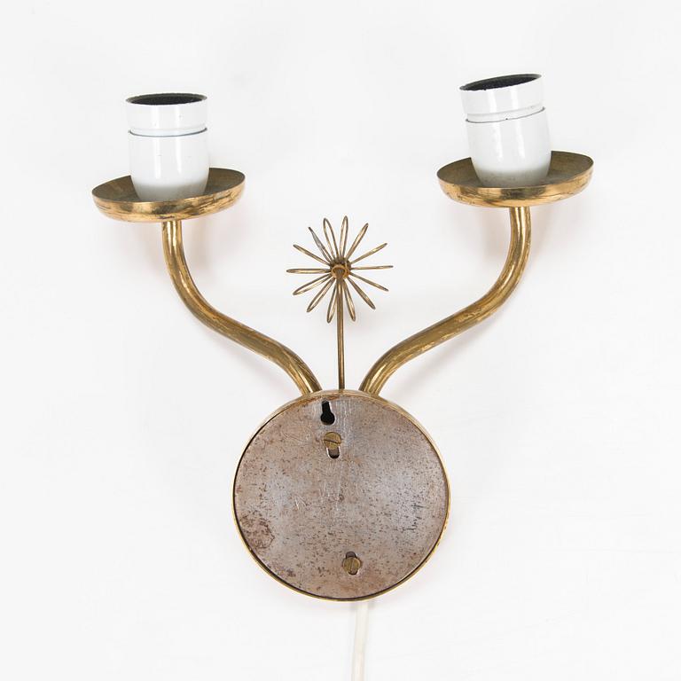 A mid-20th century wall light for Korumo.