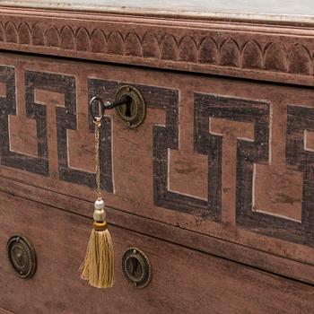 A pair of Gustavian style painted chest of drawers.