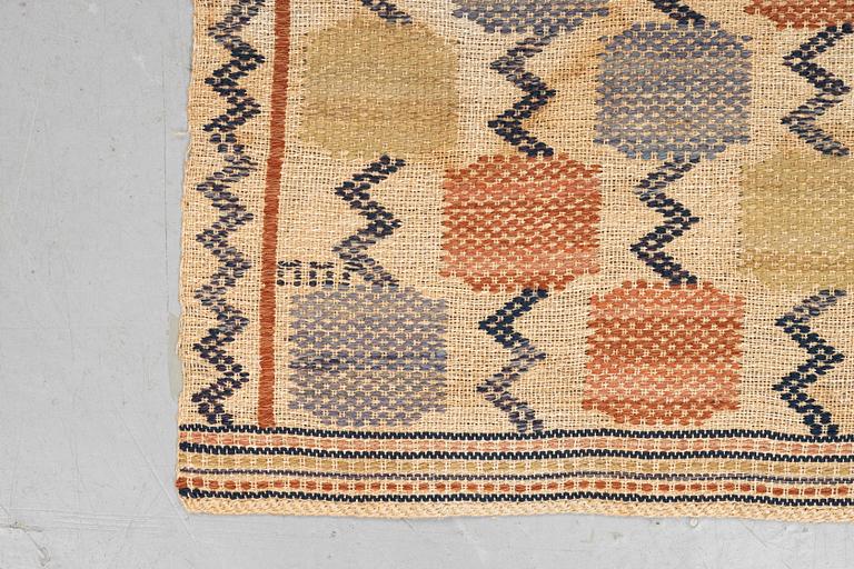 Märta Måås-Fjetterström, A textile, "Skaftblomman", flat weave, ca 131,5 x 47 cm, signed MMF.