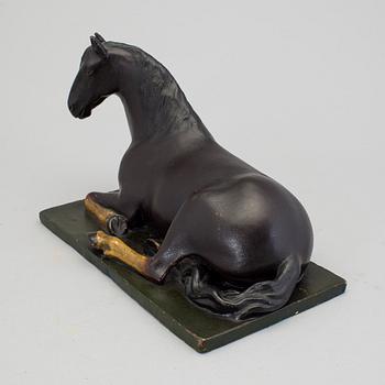 A papier mache horse signed and dated 1799.