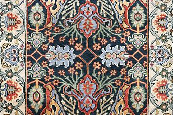 An oriental carpet with Mamluk design, c. 308 x 250 cm.