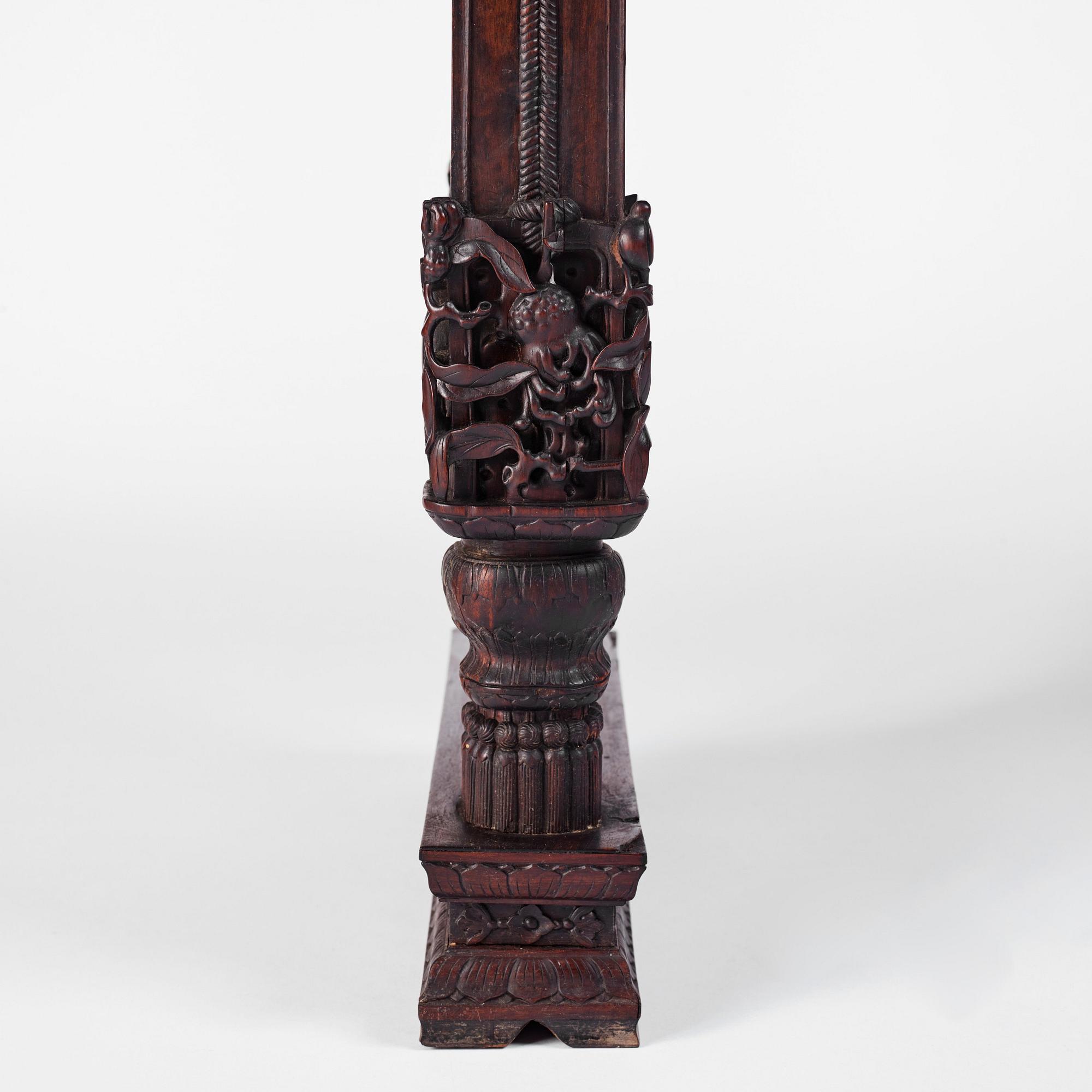 A massive zitan recessed-leg long table 'Jiaotousun Qiotouan', Qing dynasty, 19th century.