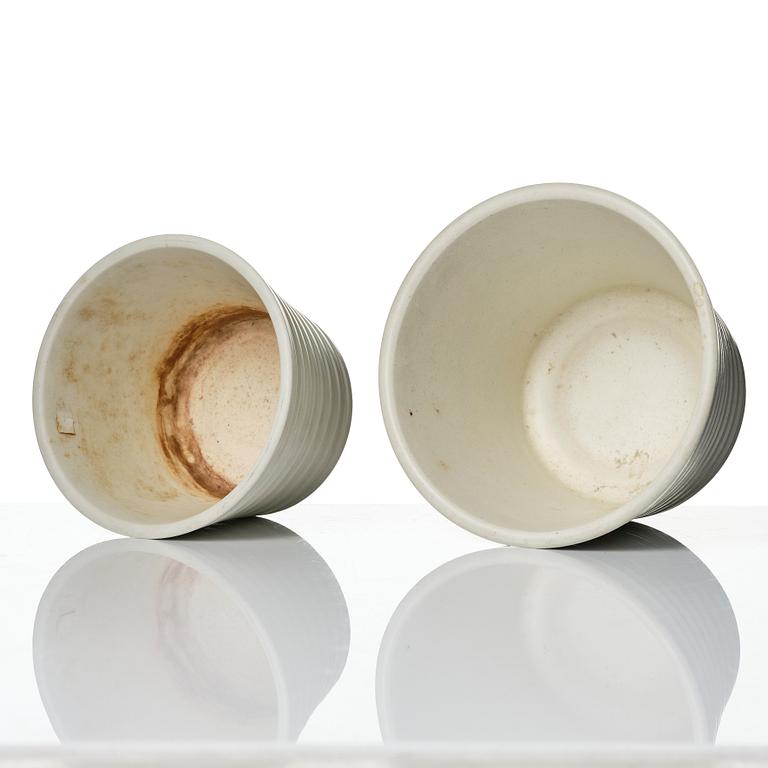 Wilhelm Kåge, A set of three ceramic flower pots, a vase and jar with lid,  Gustavsberg 1930s.