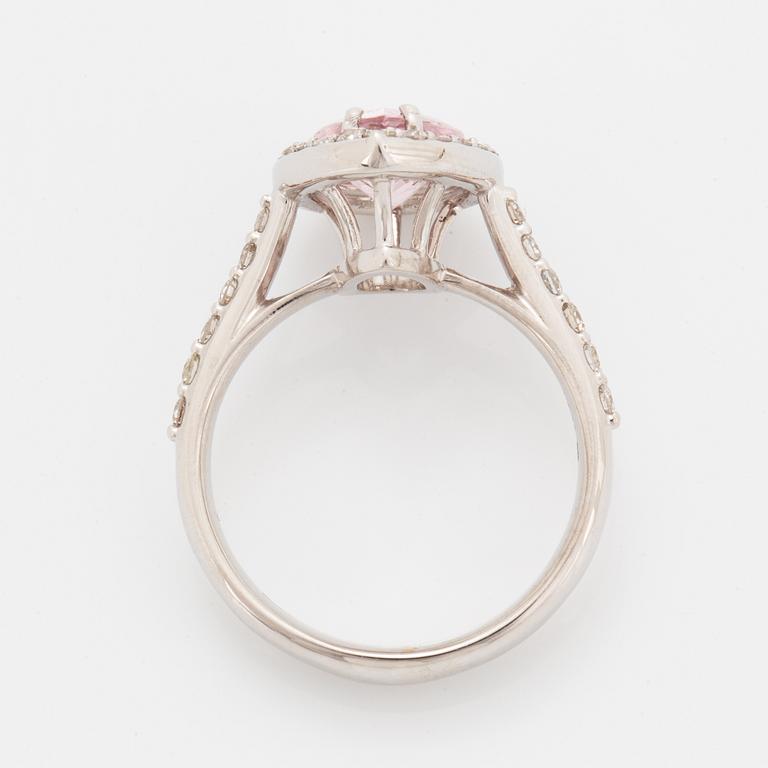 An 18K gold ring set with a faceted morganite.