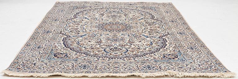 A Nain carpet, c. 310 x 195 cm.