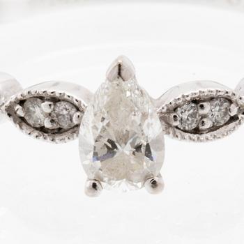 Ring in 18K white gold set with a pear-shaped diamond and round brilliant-cut diamonds, Van Bruun.