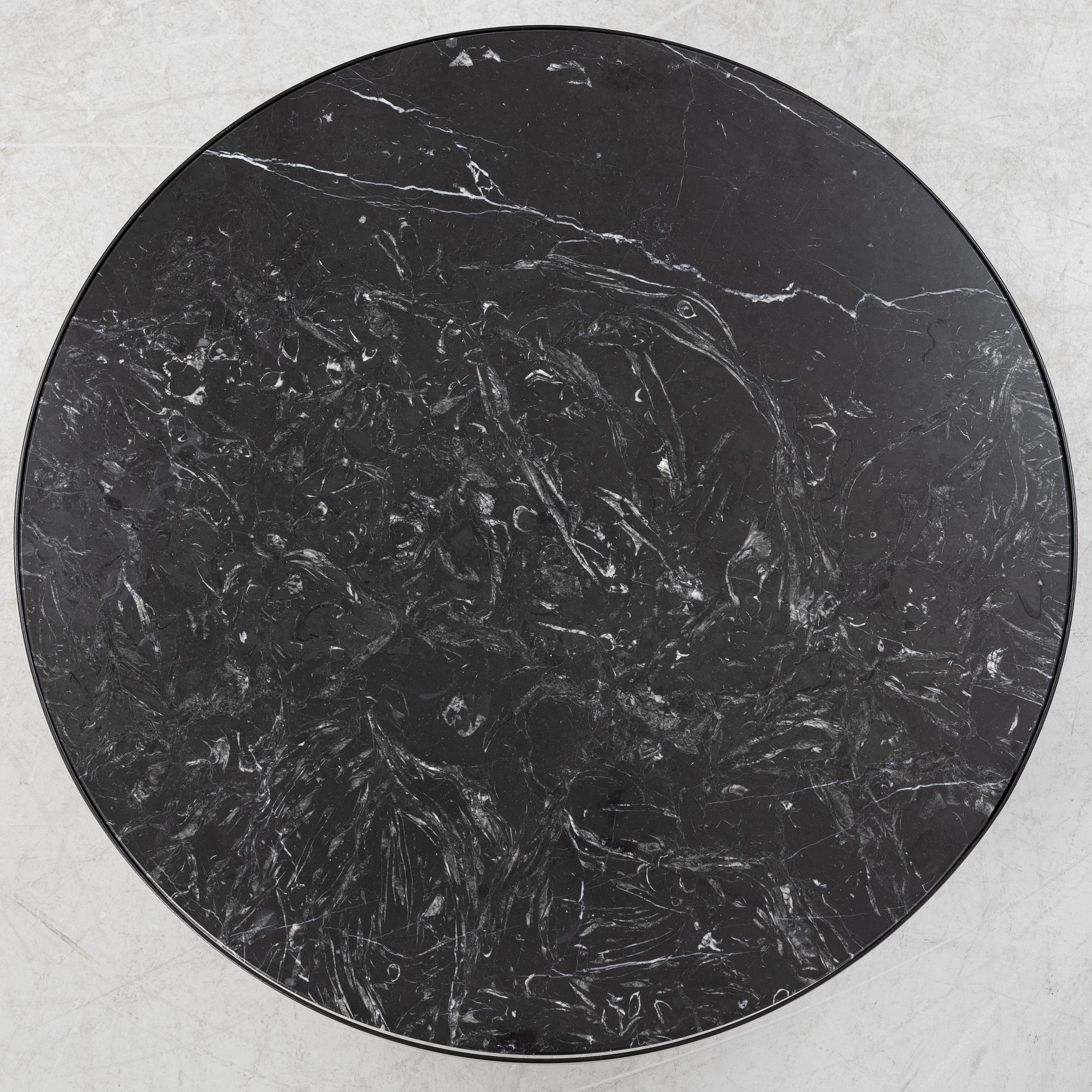 A marble top coffe table by Ferm Living, Denmark.