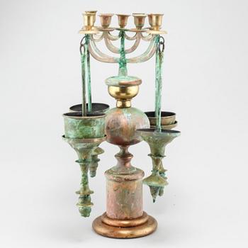 a metal sculpture/candelabra, signed and dated 2006.