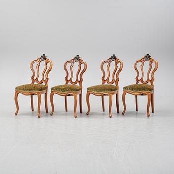 A rococo style sofa, four chairs and a table, second half of the 19th Century.