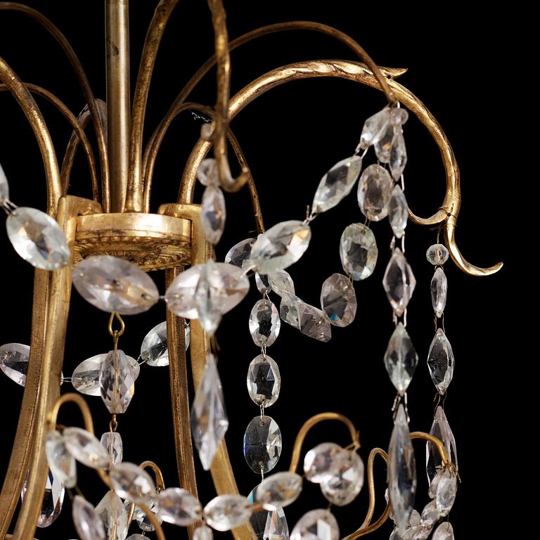 A German Louis XVI ormolu and cut-glass nine-light chandelier attributed to Johann Christoph Ermisch, late 18th century.