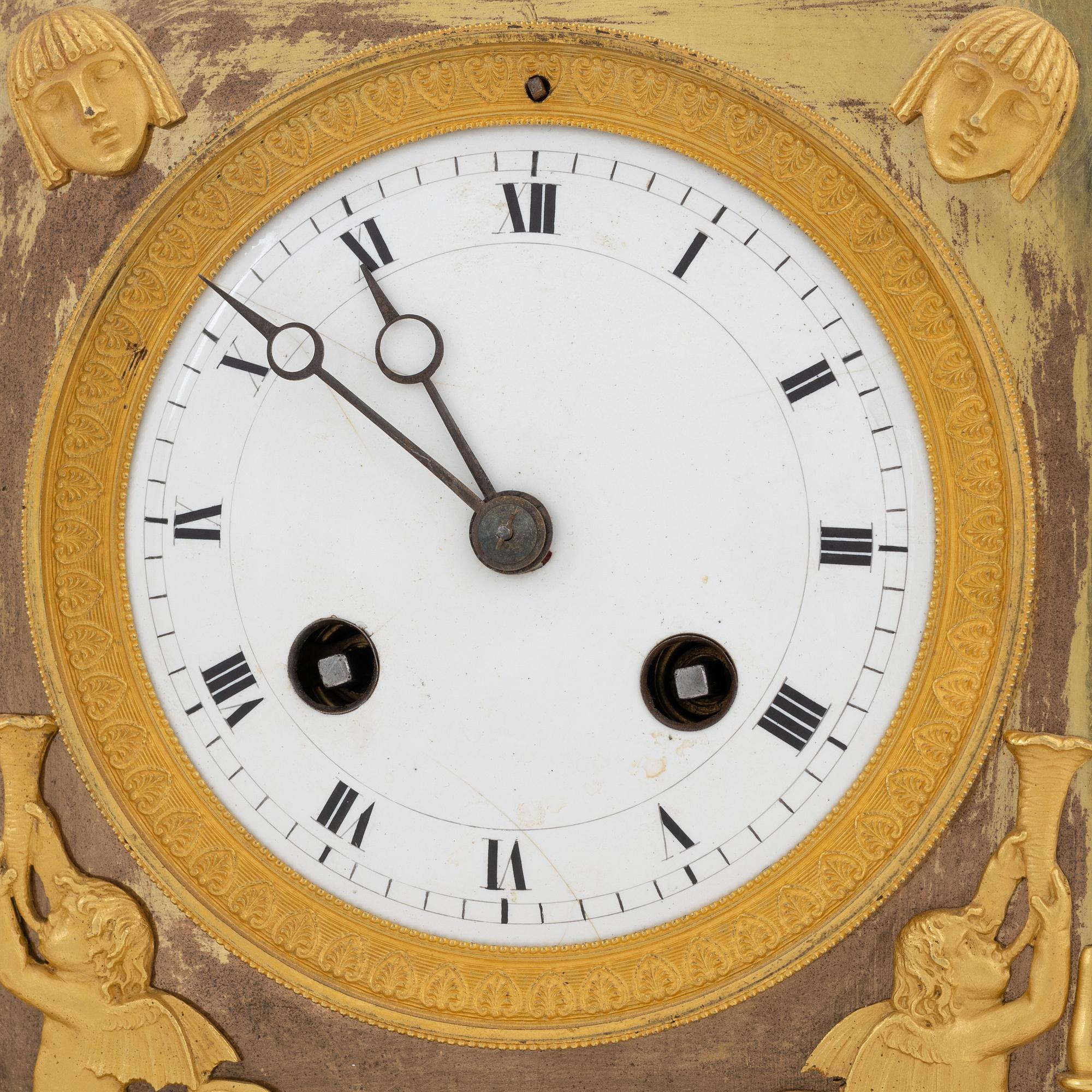 A French Empire gilt bronze mantle clock, early 20th Century.