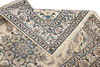 A Nain part silk rug, c. 193 x 148 cm.