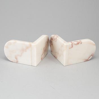 A pair of marble book ends, 20th century.