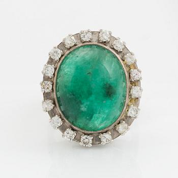 Cabochon cut emerald and brilliant cut diamond ring.