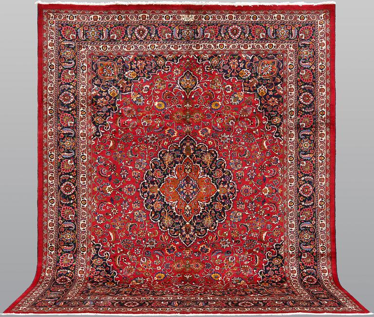 A signed Mashad carpet, ca 375 x 303 cm.