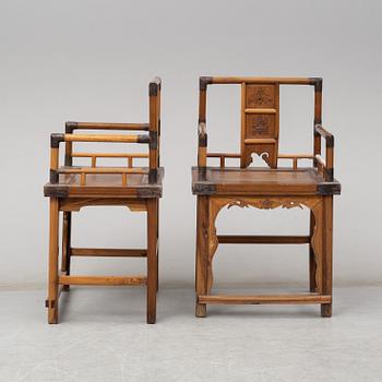 A pair of Chinese wooden armchairs, late 19th/early 20th century.