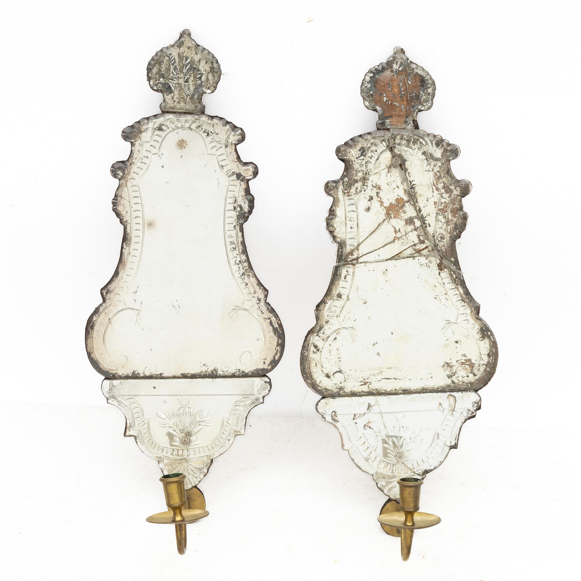 A pair of Nort European late baroque one-light girandole mirrors, mid 18th century.