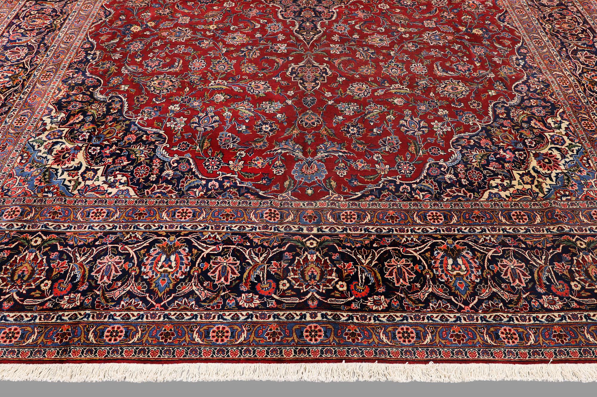 A semi-antique Keshan carpet, signed, 449 x 317 cm.