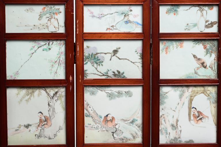 A Chinese folding screen with 48 porcelain tiles, late Qing dynasty, signed Ren Huanzhang, and dated 1881.