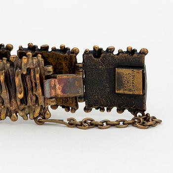 A bronze bracelet, ring and a pair of earrings by Pentti Sarpaneva, Finland.