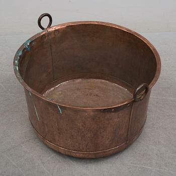 A 19th century copper cauldron.