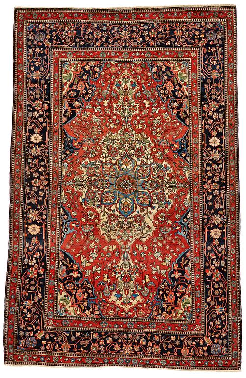 A RUG, an antique/semi-antique Kashan Motachem, ca 213 x 141,5 cm.