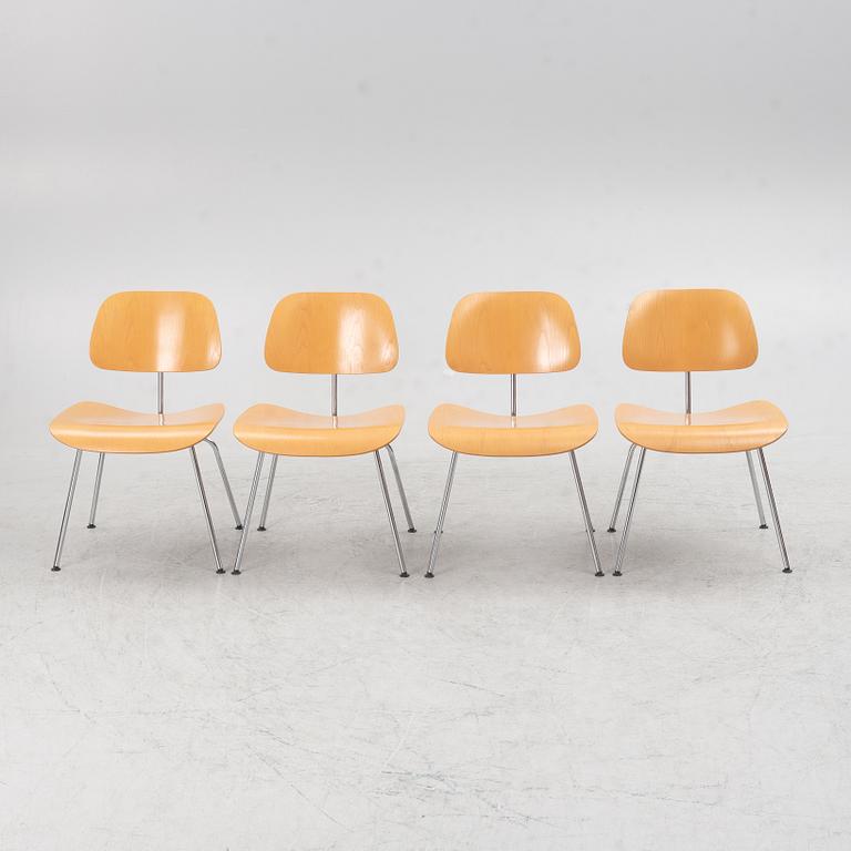Charles & Ray Eames, a set of four 'DCM' chairs, Vitra, dated 2002.