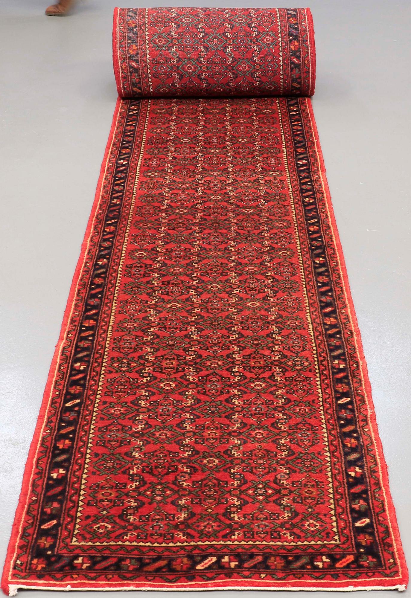 A Hosseinabad runner, approx. 1360 x 80 cm.