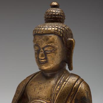 Two copper alloy figures of buddha, Sino-Tibetan, circa 1900.
