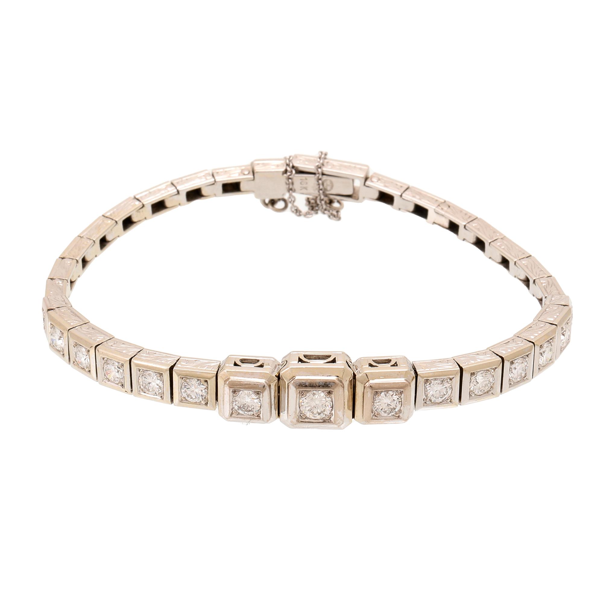 An 18K white gold bracelet with brilliant cut diamonds.