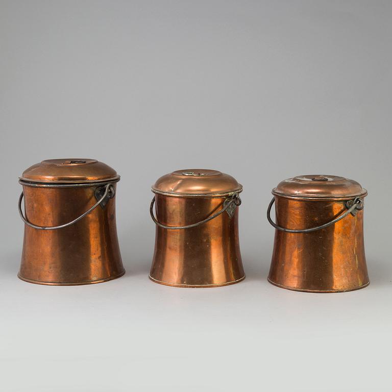 THREE 19TH CENTURY COPPER MILK CHURNS.