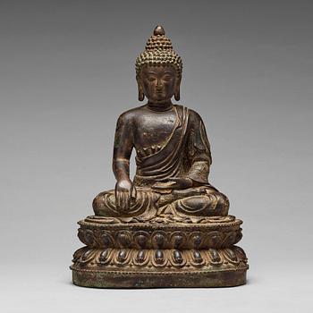 688. A bronze seated figure of Shakayamuni buddha, Mingtype.