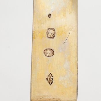 A set of eleven gilt silver dessert knives with mother-of-pearl stems, Paris 1819-1838.