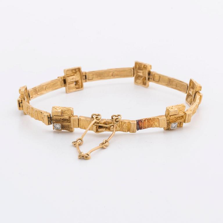 LAPPONIA ARMBAND 18K guld m 6 diamanter 8/8 0,12 ct totalt enligt gravyr, Finland 1976.
