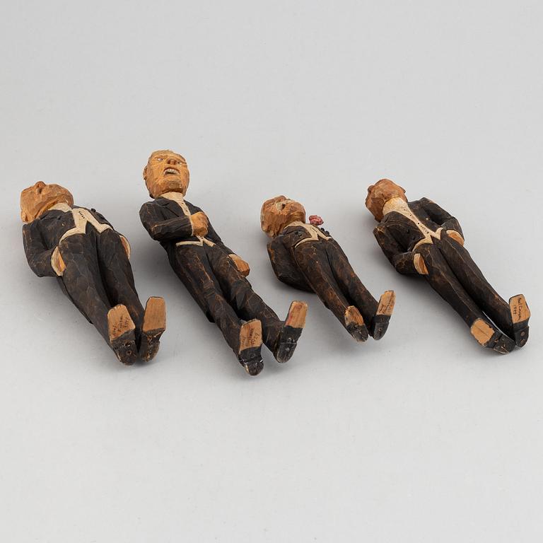 Four wooden sculptures by Axel Ericsson, signed and dated -29.