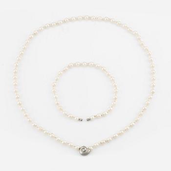 Ole Lynggard lås i form av snäcka 18K vitguld med en rund briljantslipad diamant.