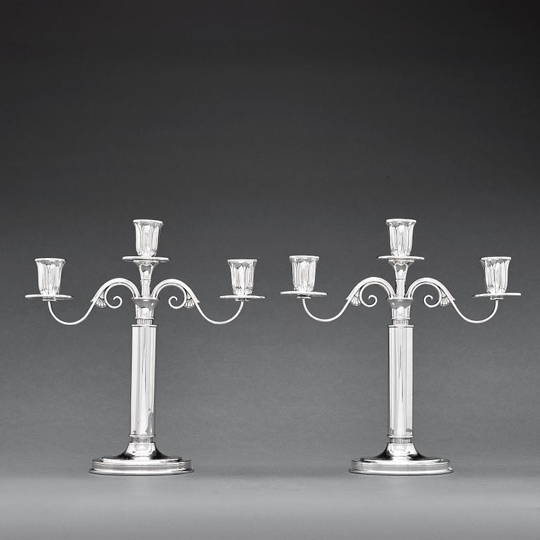 W.A Bolin, a pair of two branched silver candelabra, Stockholm 1935.