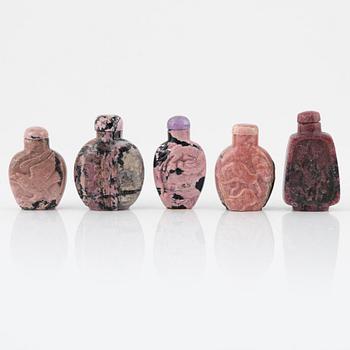 Nine Chinese snuff bottles in mottled stone, 20th century.