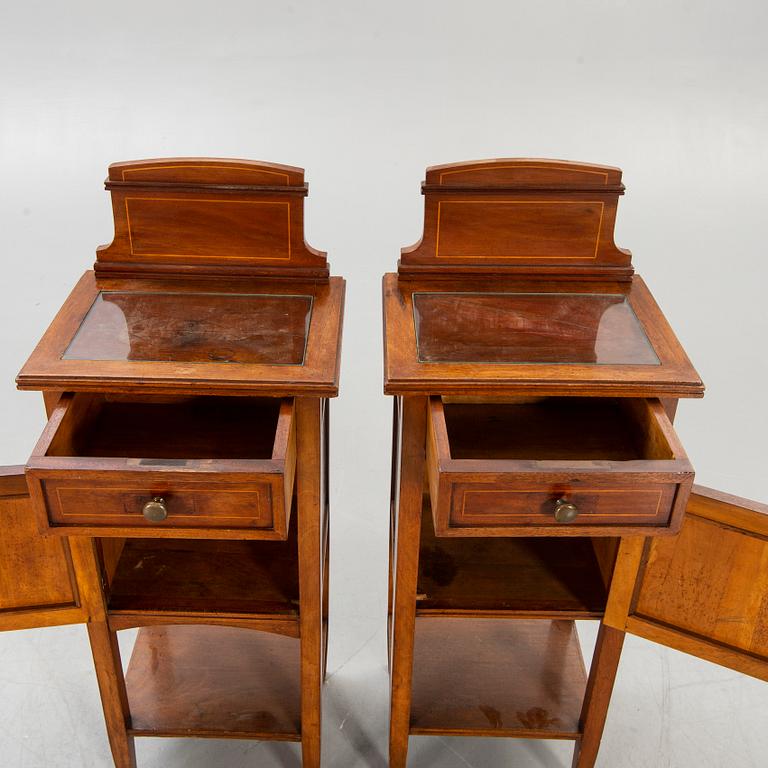 A pair of early 1900s bedside tables.