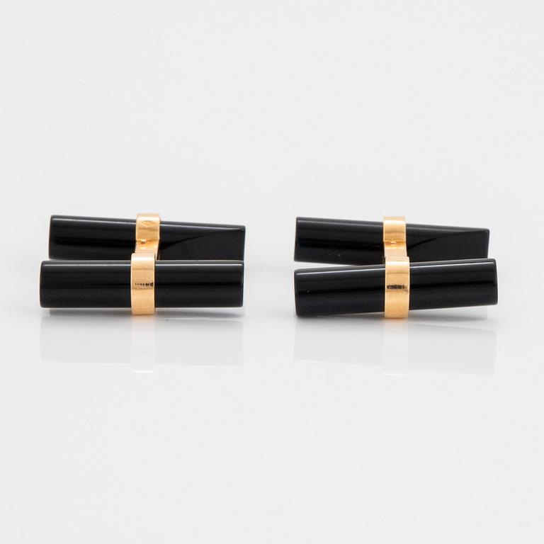 Cartier ett par manschettknappar 18K guld och onyx.